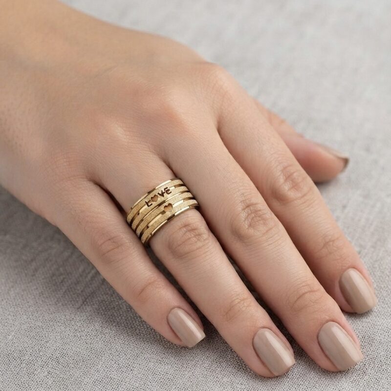 Anel love grosso dourado em aço premium atacado
